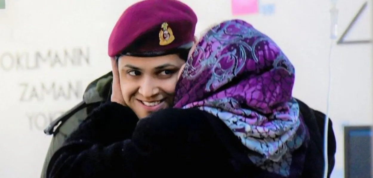 A Turkish woman hugging and kissing an India Army doctor