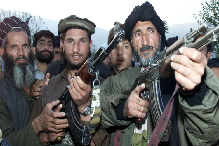 Militants of TTP brandishing their weapons
