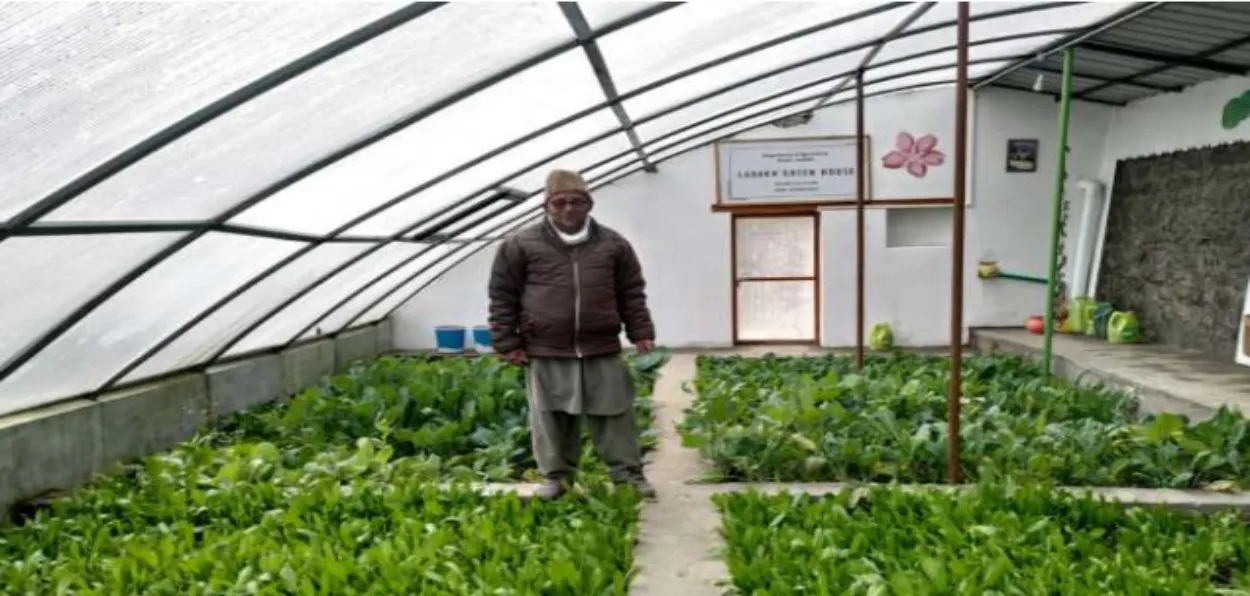 A Ladakhi man inside his polyhouse in Kargil during winter (Information department)