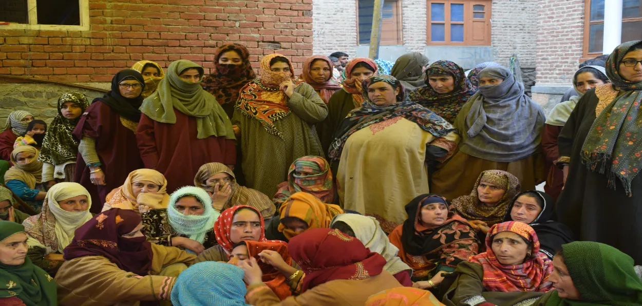 Muslim women of village Achen with the wife of the slain Kashmiri Pandit Sachin Sharma (Pictures Basit Zargar)