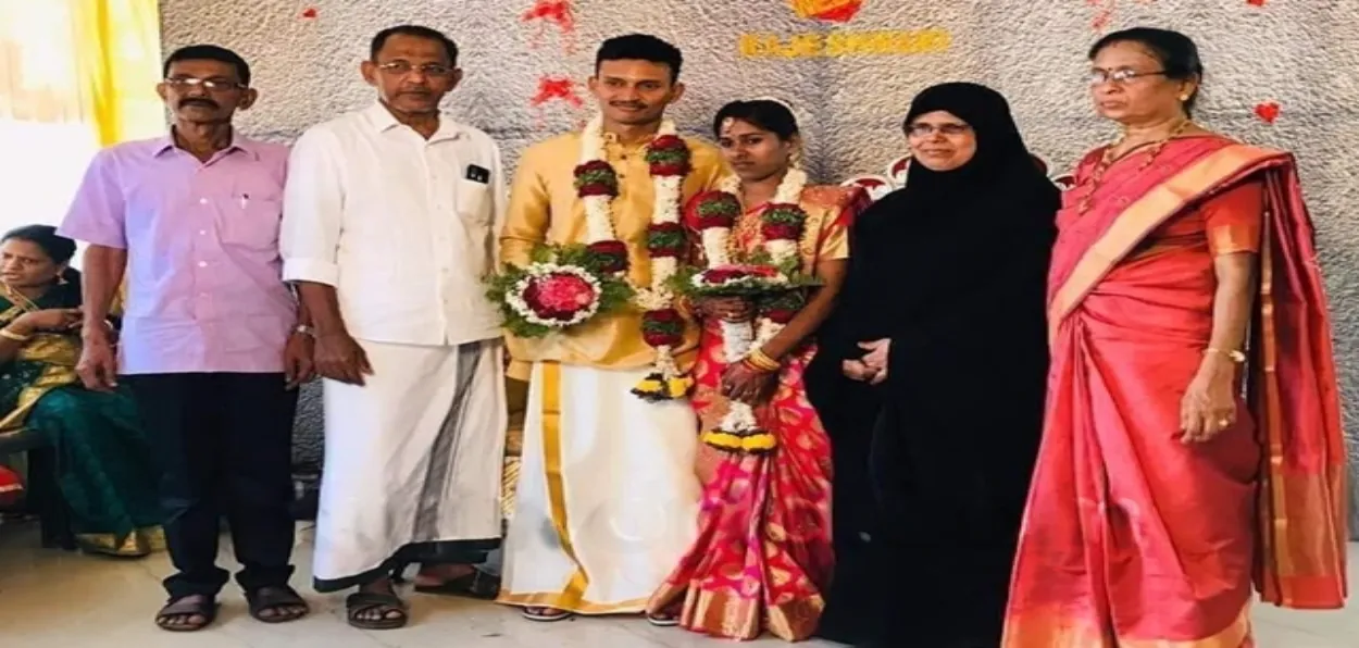 Abdulla and Khadeeja with Rajeshwari, her groom Vishnuprasad and his parents after their wedding