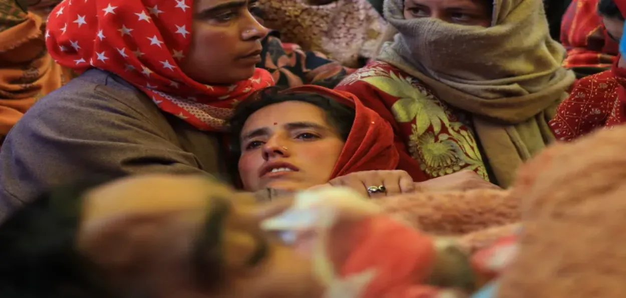 Kashmiri Muslim Village women of Achen consoling the wife of Sanjay Sharma (Basit Zargar)