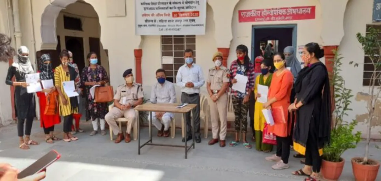 Yusuf Khan (Standing) with the girls who passed out from boards and the Policemen of Jaipur (Courtesy India  tomorrow)