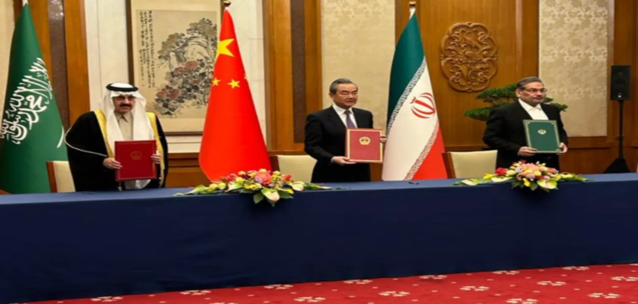 Iran’s Ali Shamkhani, Saudi Arabia’s NSA Musaed bin Mohammed Al-Aiban and Chinese counterpart Wang Yi signing the agreement (Arab News)