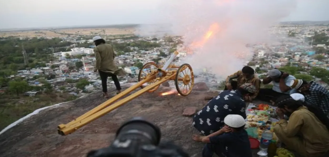 Shawkat Ullah beside the cannon after firing a cannonball
