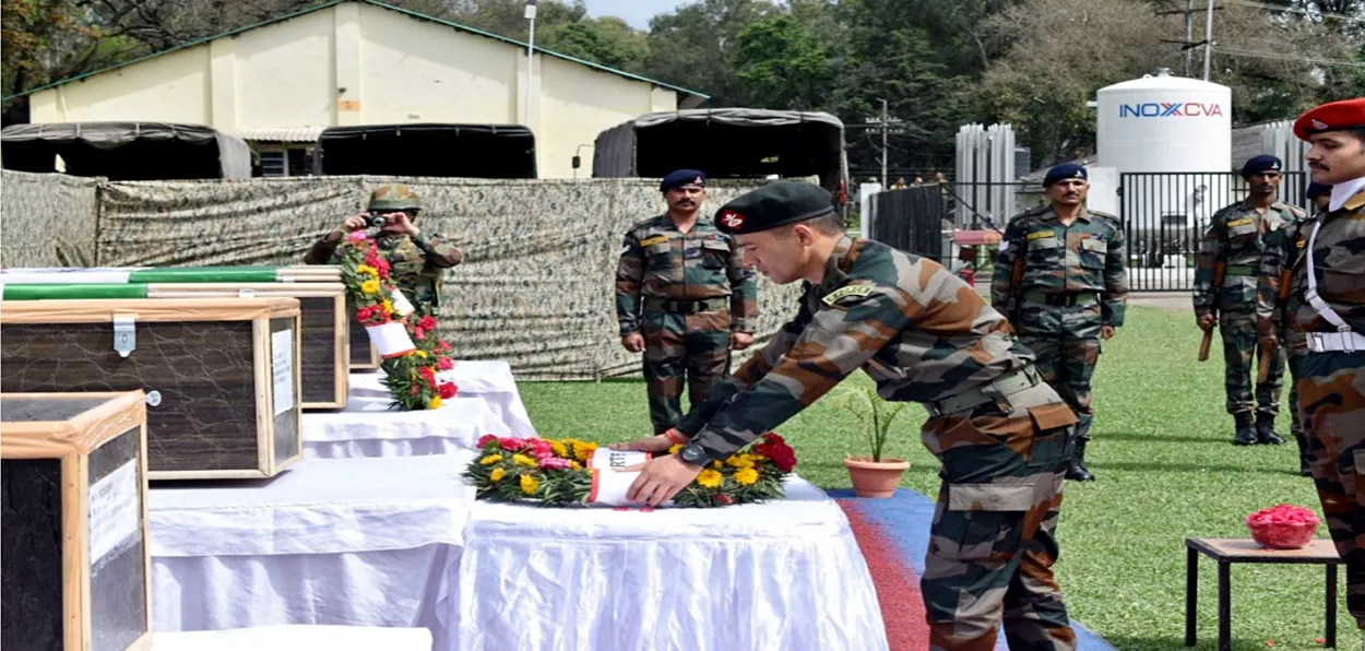 Indian Amy paying ceremonial tribute to the slain five soldiers as their coffins are about to be sent to their homes 