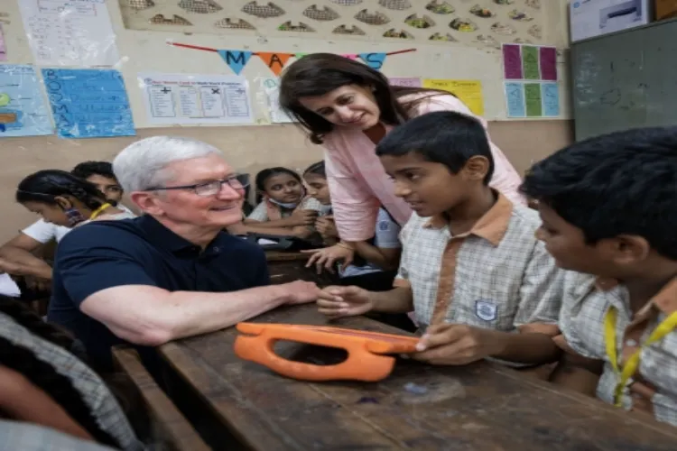 Tim Cook with kids in India