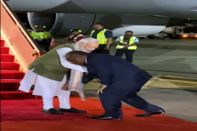 James Marape, Papua New Guinea Prime Minister touches the feet of PM Narendra Modi