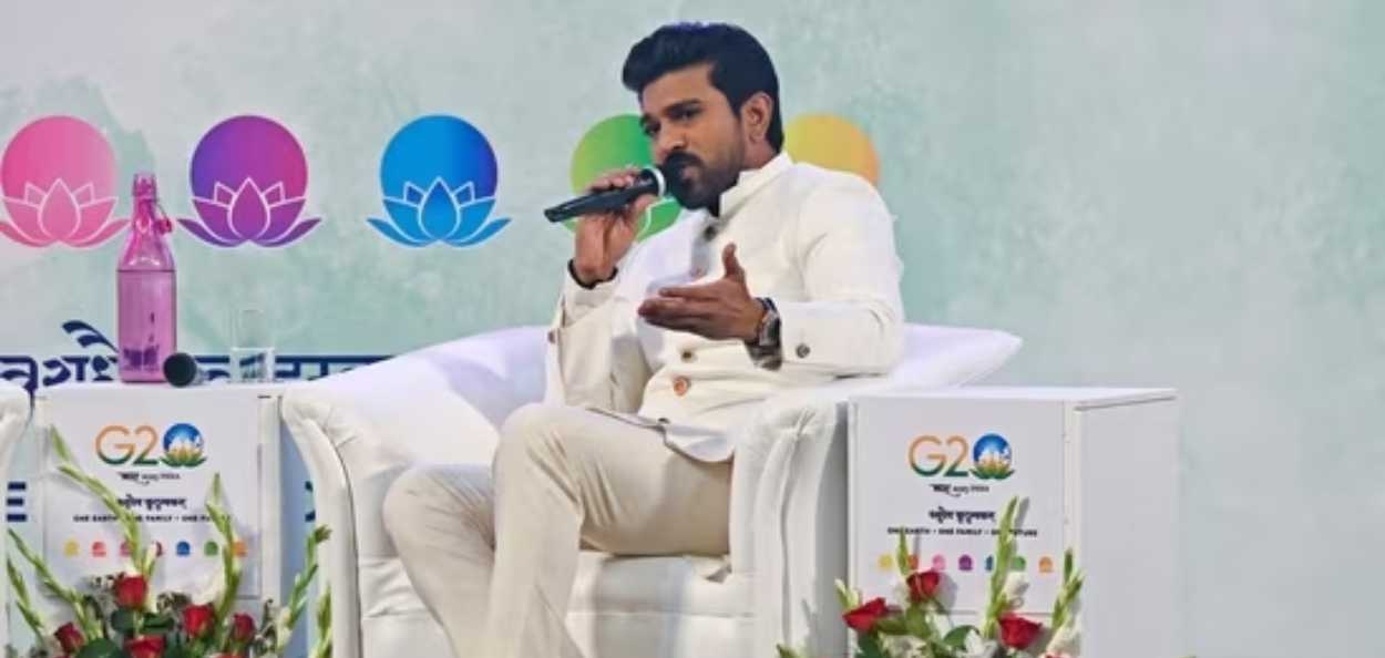 Ram Charan speaking at the convention in Srinagar