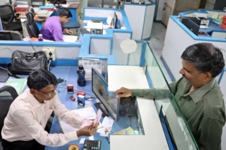 A customer exchanging a currency note of Rs 2000 at a bank