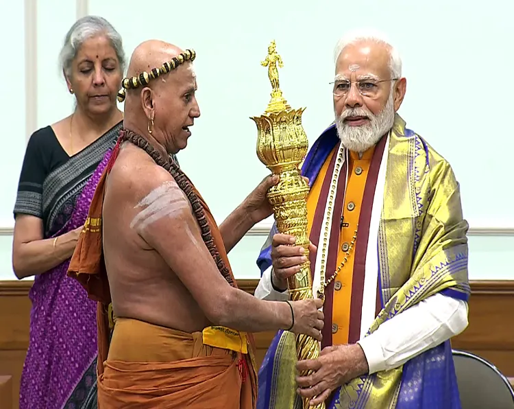 Prime Minister Modi receiving Sengdol before the inauguration of the New Parliament building