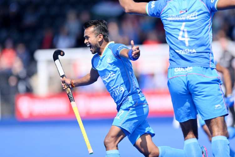 Vivek Prasad celebrates after scoring India's first goal in the 5-1 win