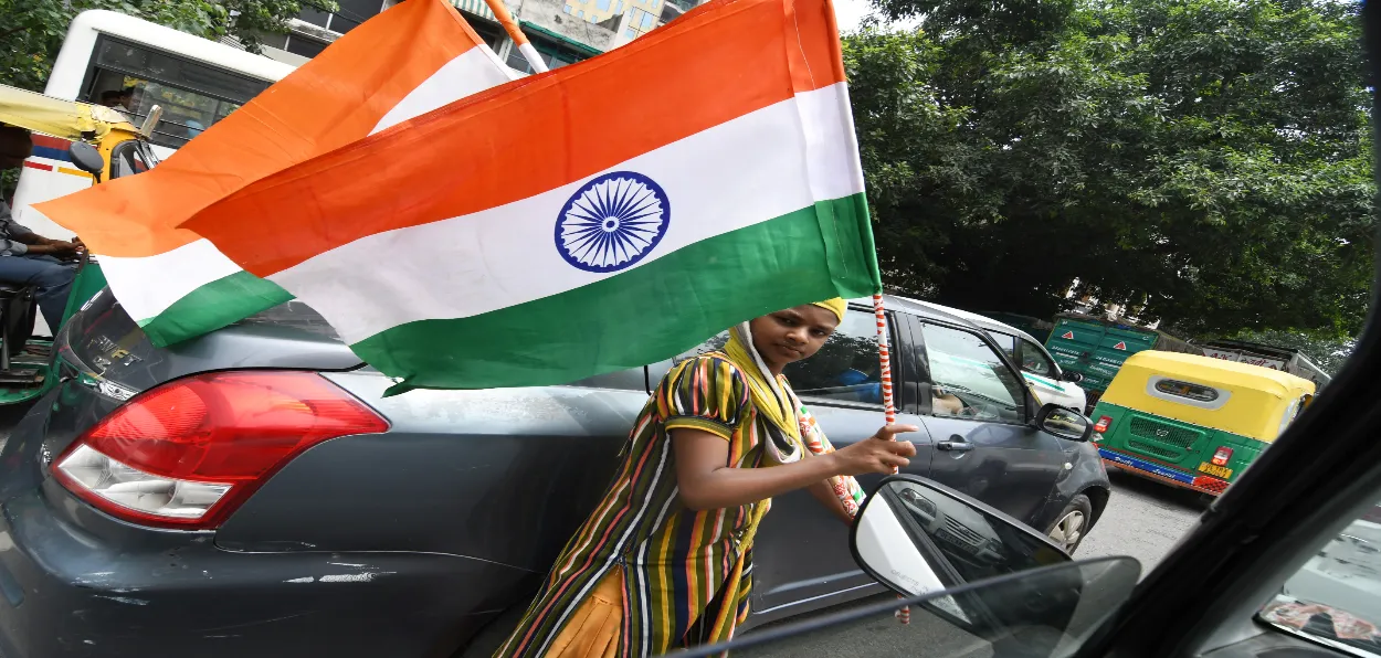 A Muslim woman selling national flag on Republic day in New Delhi (Ravi Batra)