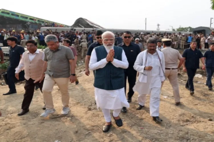 Prime Minister Narendra Modi with Railway Minister Ashwini Vaishnav and Union Minister Dharmendra Pradhan at the train accident spot in Odisha