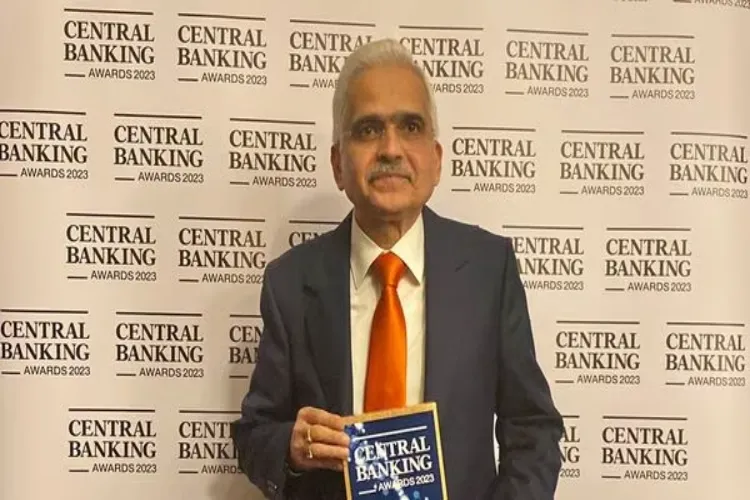 Shaktikanta Das posing with the 'Governor of the Year' award at London's Central Banking Awards 2023