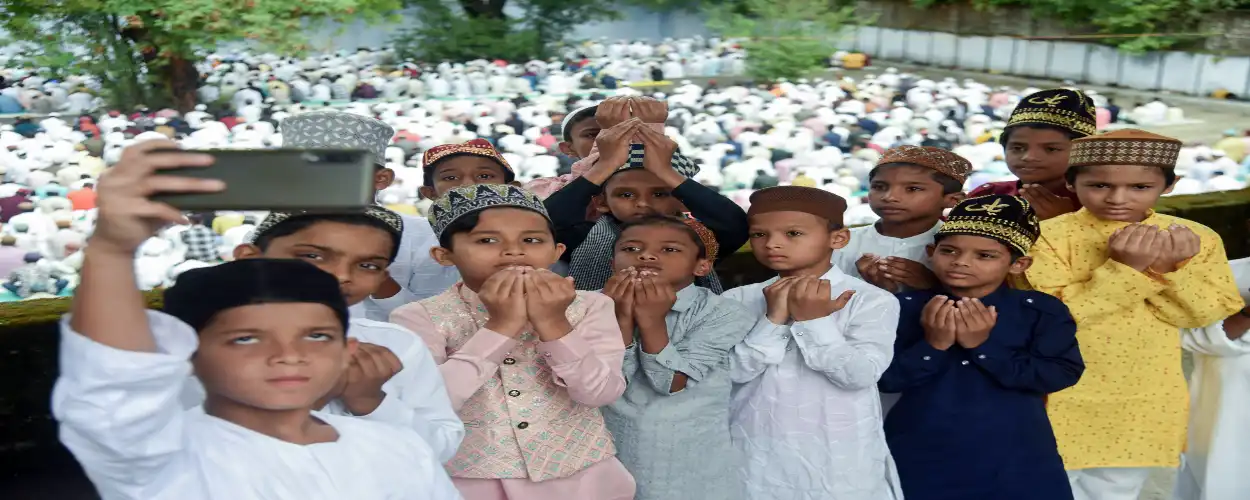 Young boys posing for a picture after offering Eid Namaz in Delhi