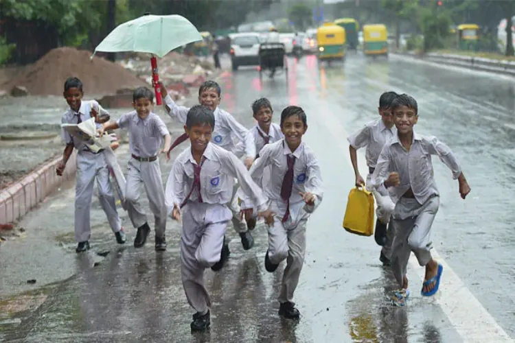 School boys coping with the the rains in Delhi
