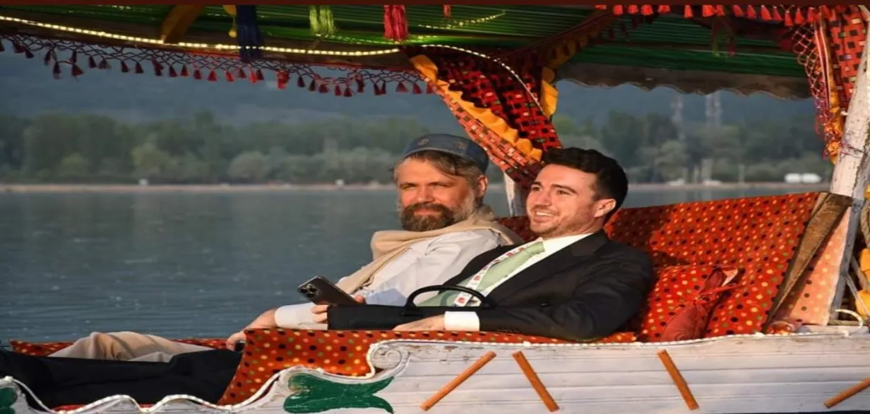 A foreign delegate to G-20 meet enjoying a Shikara ride in Dal Lake (Pictures credit Basit Zargar)