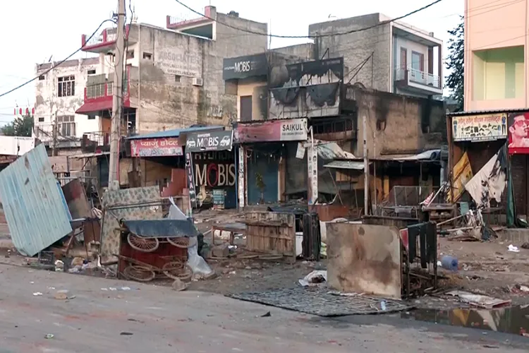 A Nuh marketplace where shops set afire