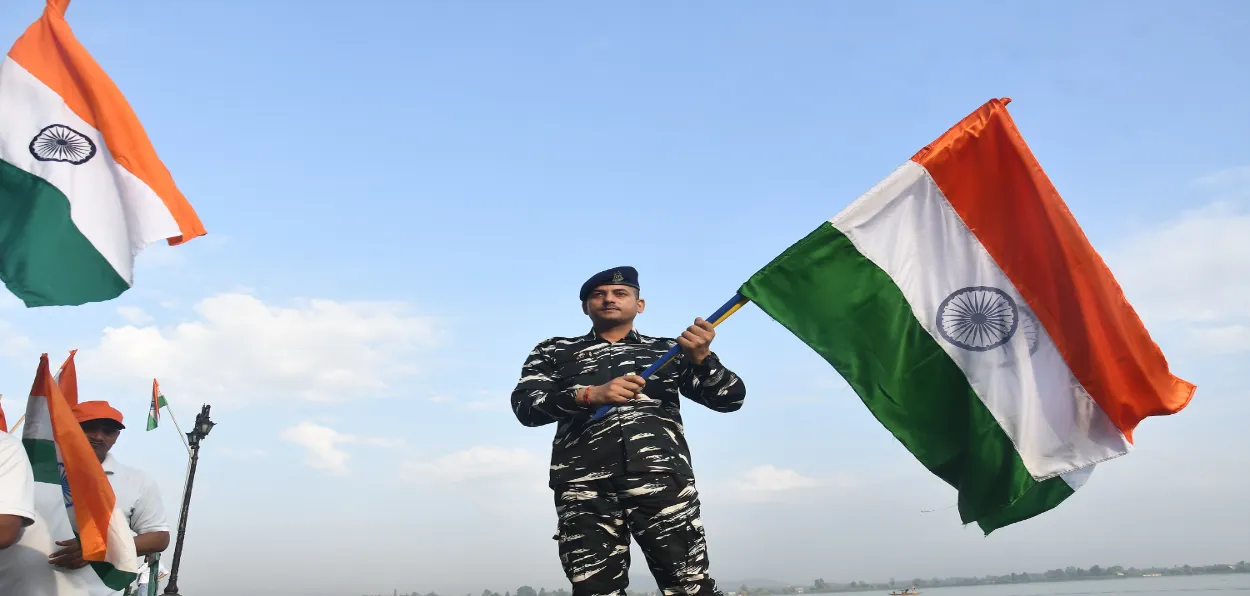 A Soldier holding Indian National Flag in Srinagar (Basit Zargar)