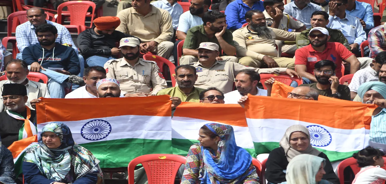 Locals seeing the ceremonial Independence Day Parade  in Srinagar's Bakshi Stadium (Basit Zargar)