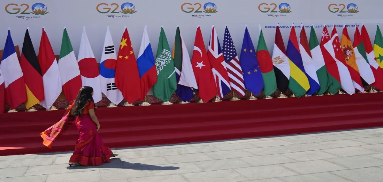 A woman walks past one of the venues of the G-20 meetings prior to the Summit 
