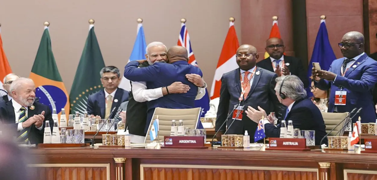 Prime Minister Narendra Modi hugs African Union President Comoros Azali Assoumani as the latter joins G20 as permanent member at New Delhi G-20 Summit (Courtesy: PIB)