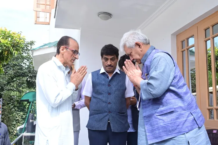 LG Manoj Sinha meeting former IGP Ghulam Hassan Bhat, father of the martyred J&K Police DySP Humayun Bhat at his residence