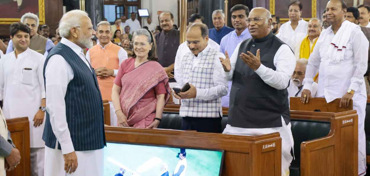 Prime Minister Narendra Modi sharing a lighter moment with Congress leaders on the first day of the Special session of Parliament in the Old building