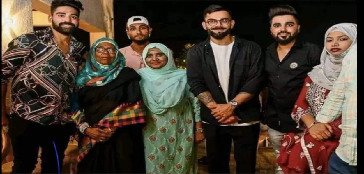 Virat Koholi with the family of Mohammad Siraj (Facebook)