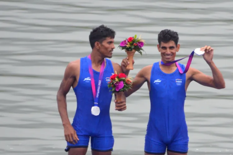 Indian rowers Arvind Singh and Arjun Lal Jat celebrating their victory