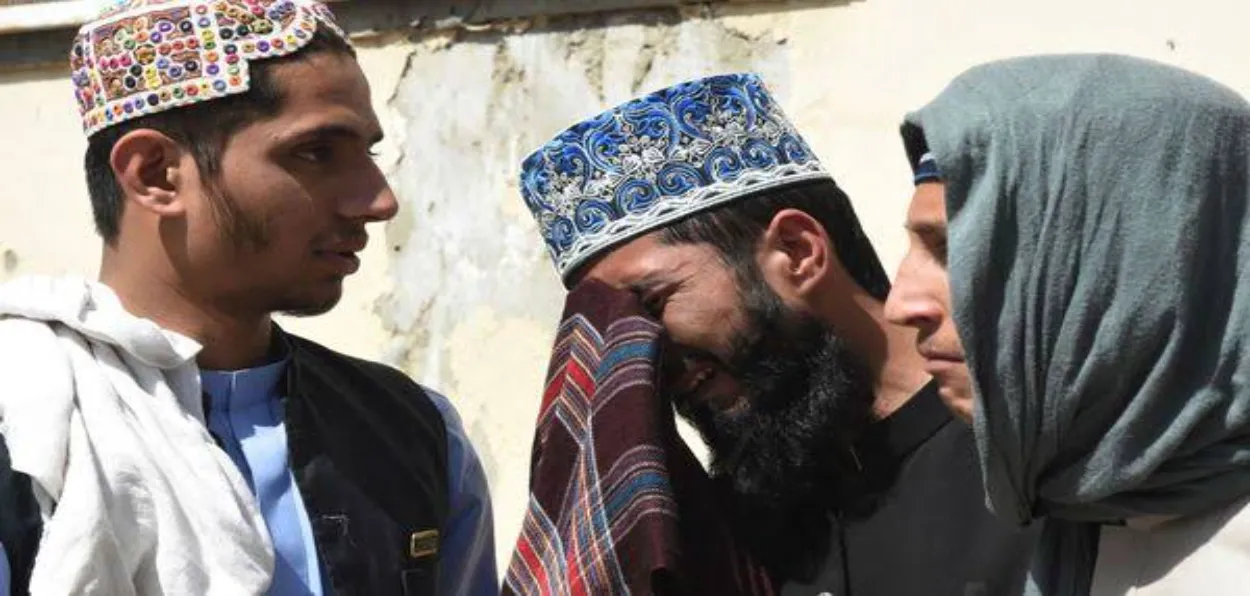 A person breaks down at the site of recent suicide blast at Mustang in Balochistan on the day of Eid un Milad Nabi