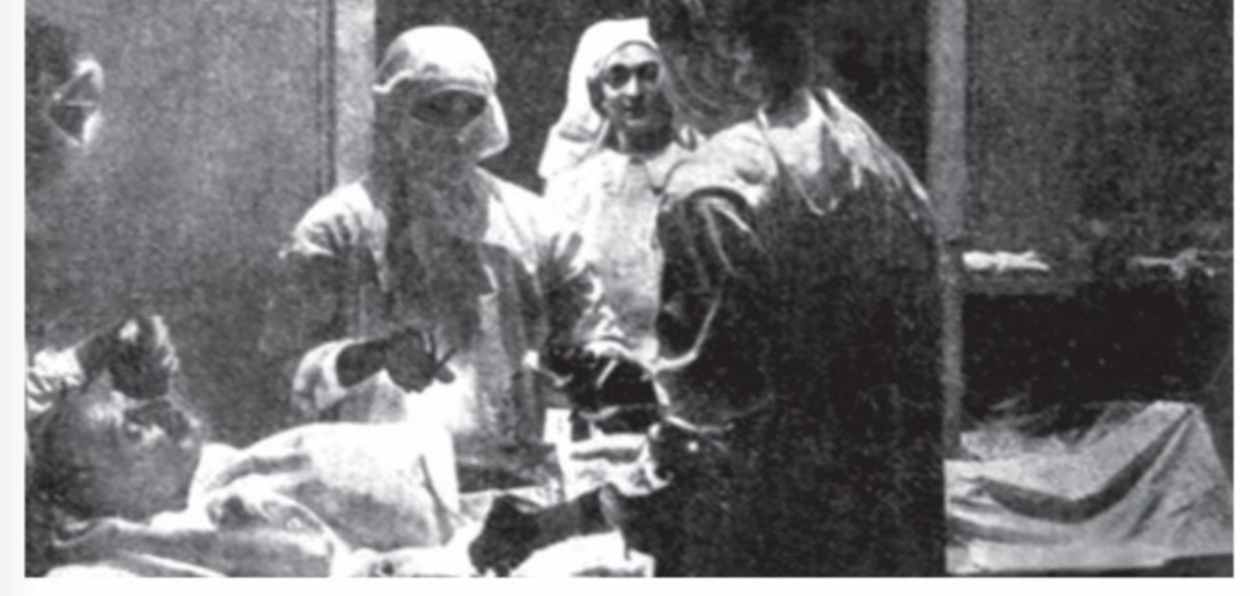 Mahtama Gandhi being operated upon by Dr Maddock and his team 