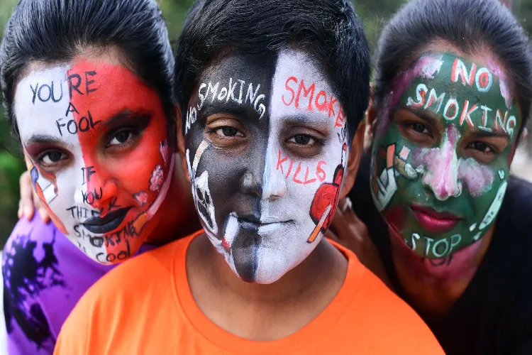 Young Indian with their painted faces give message against smoking