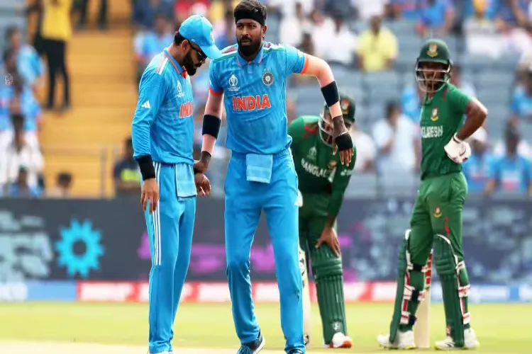 An injured Hardik Pandya holds Virat Kohli for support during a match