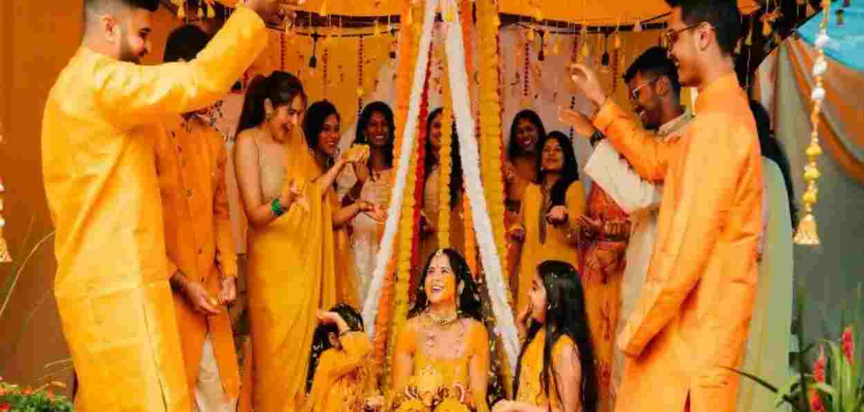 A would be bride sitting for her Mehndi ceremony