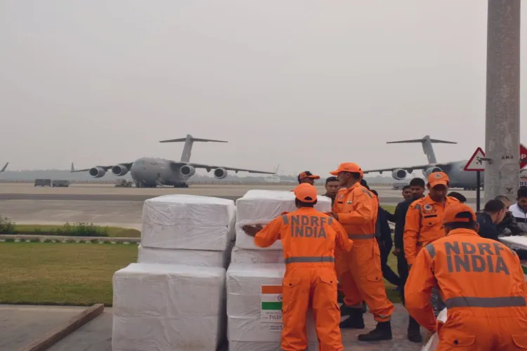 NDRF personnel loading humanitarian aid for Palestinian people in an IAF plane