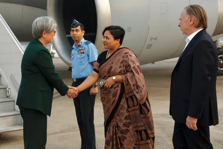 Senator Penny Wong receiving a welcome at Delhi airport