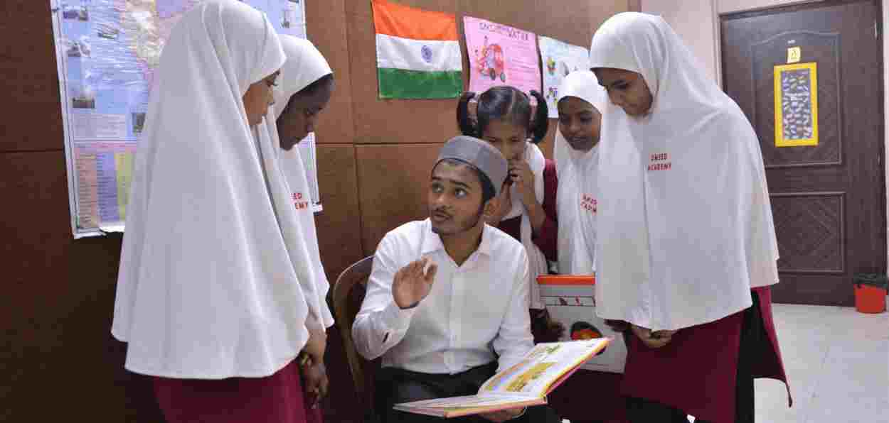Wali Rahmani with girl students of Umeed Academy