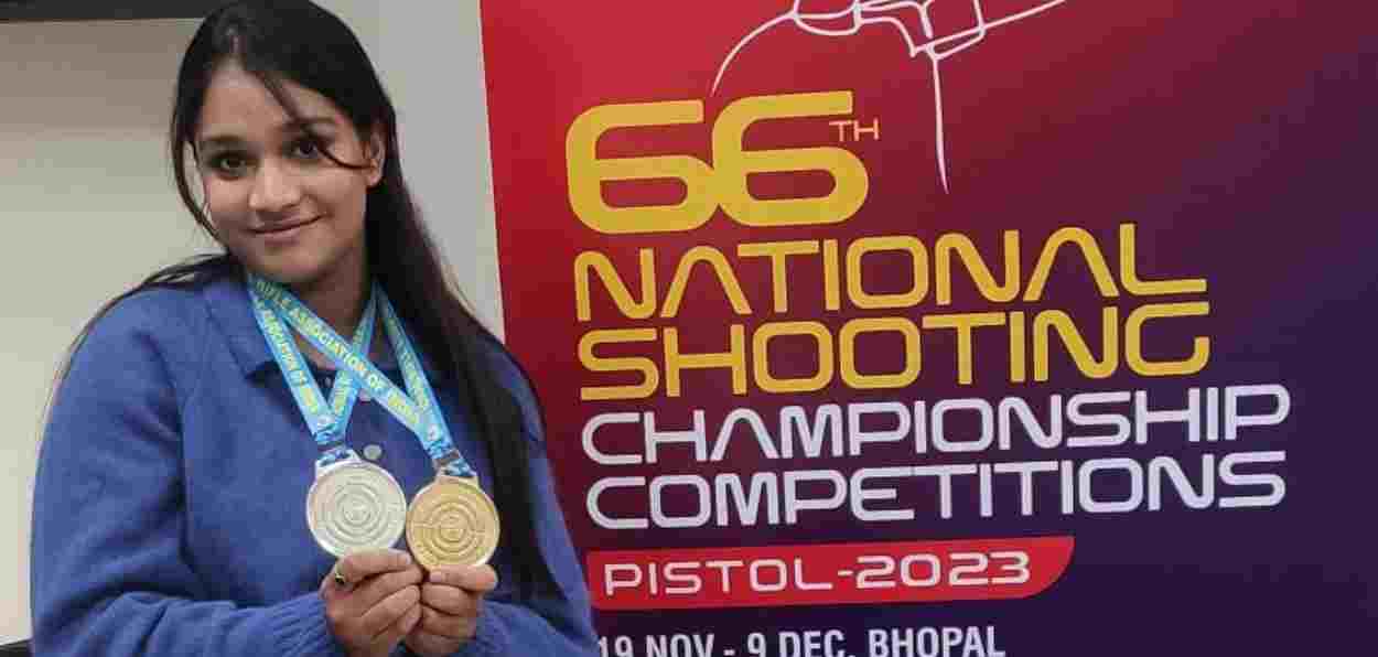 Adeeba Ali showing her gold and silver medal