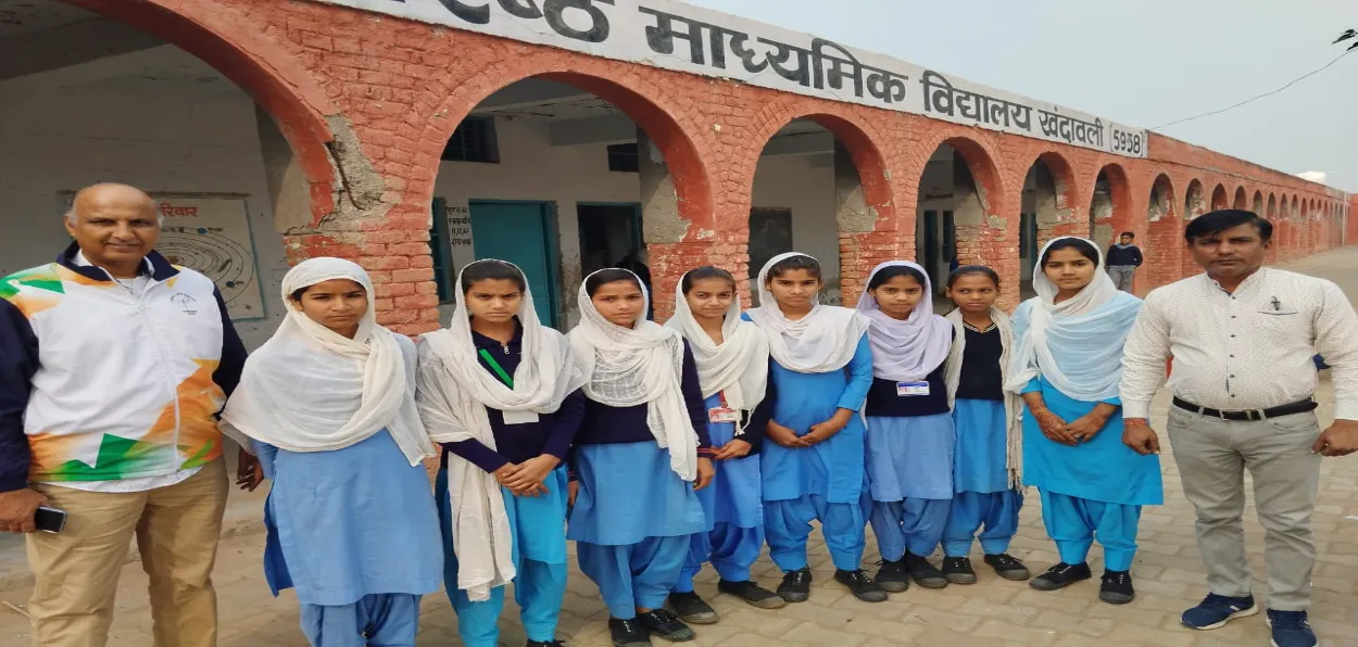 members of girls Kho Kho team with teacher Rajesh Ahlawat (left) and sports teacher Prakash Veer