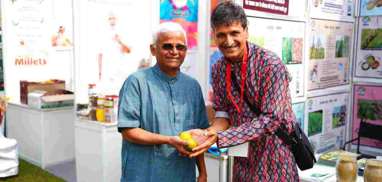 India's Millet man Dr Khadar Valli with an activist at the Mega Millet Mahotsav