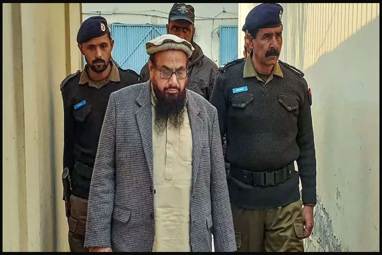 26/11 terror attacks mastermind Hafiz Saeed with policemen