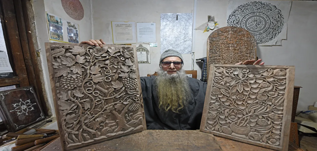 Ghulam Nabi Dar with his masterpieces (Images: Basit Zargar)