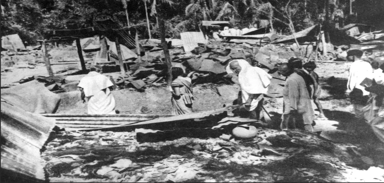 Mahatma Gandhi inspecting the houses destroyed in the post-partition violence