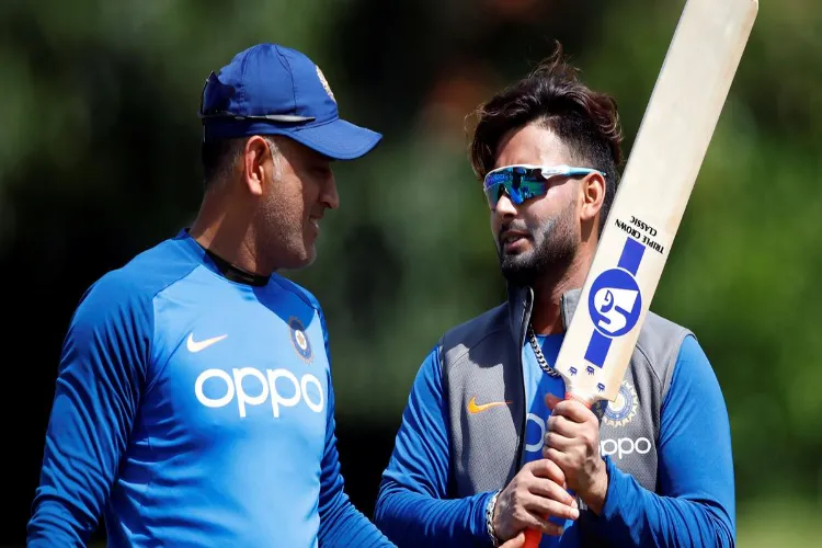 Former Indian captain M S Dhoni with Indian keeper Rishabh Pant