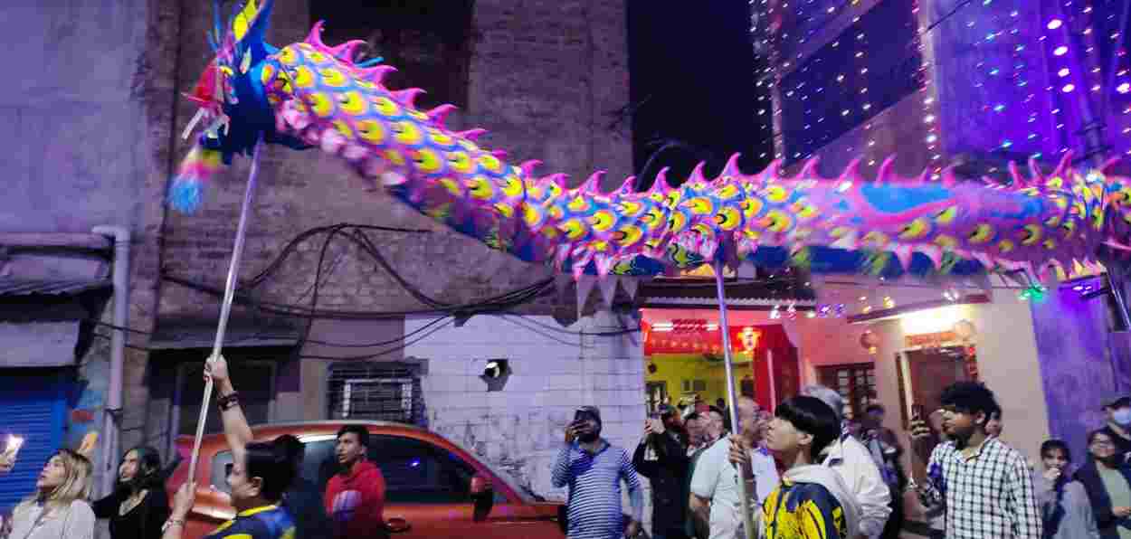 Traditional Purple dragon being taken out in a procession in Tanga