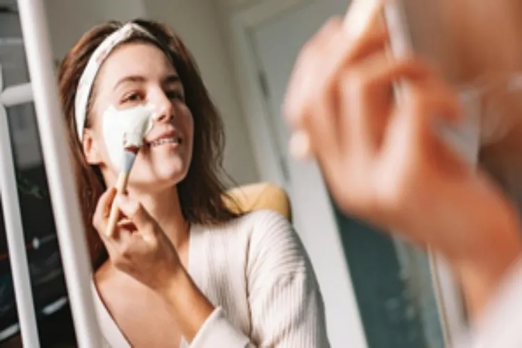 A lady using a face pack made from raw milk