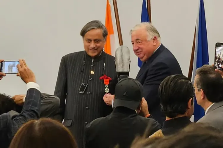 Former UN diplomat Shashi Tharoor being conferred with the highest civilian honour of France by Chairman of the French Senate Gerard Larcher,
