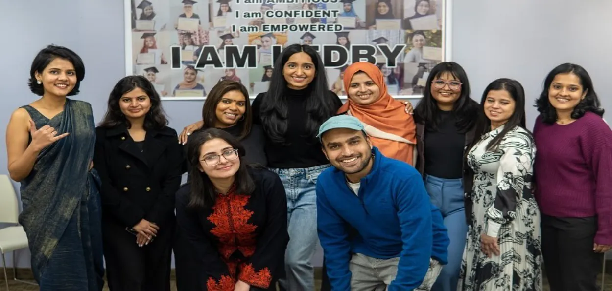 Ruha Shadab in the center(Wearing black top and jeans) with her team